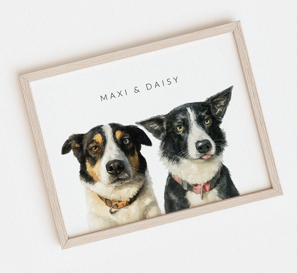Framed watercolor artwork of two dogs named Maxi and Daisy on a white background