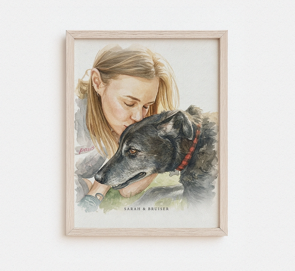 Framed artwork of a woman and a dog on a white wall