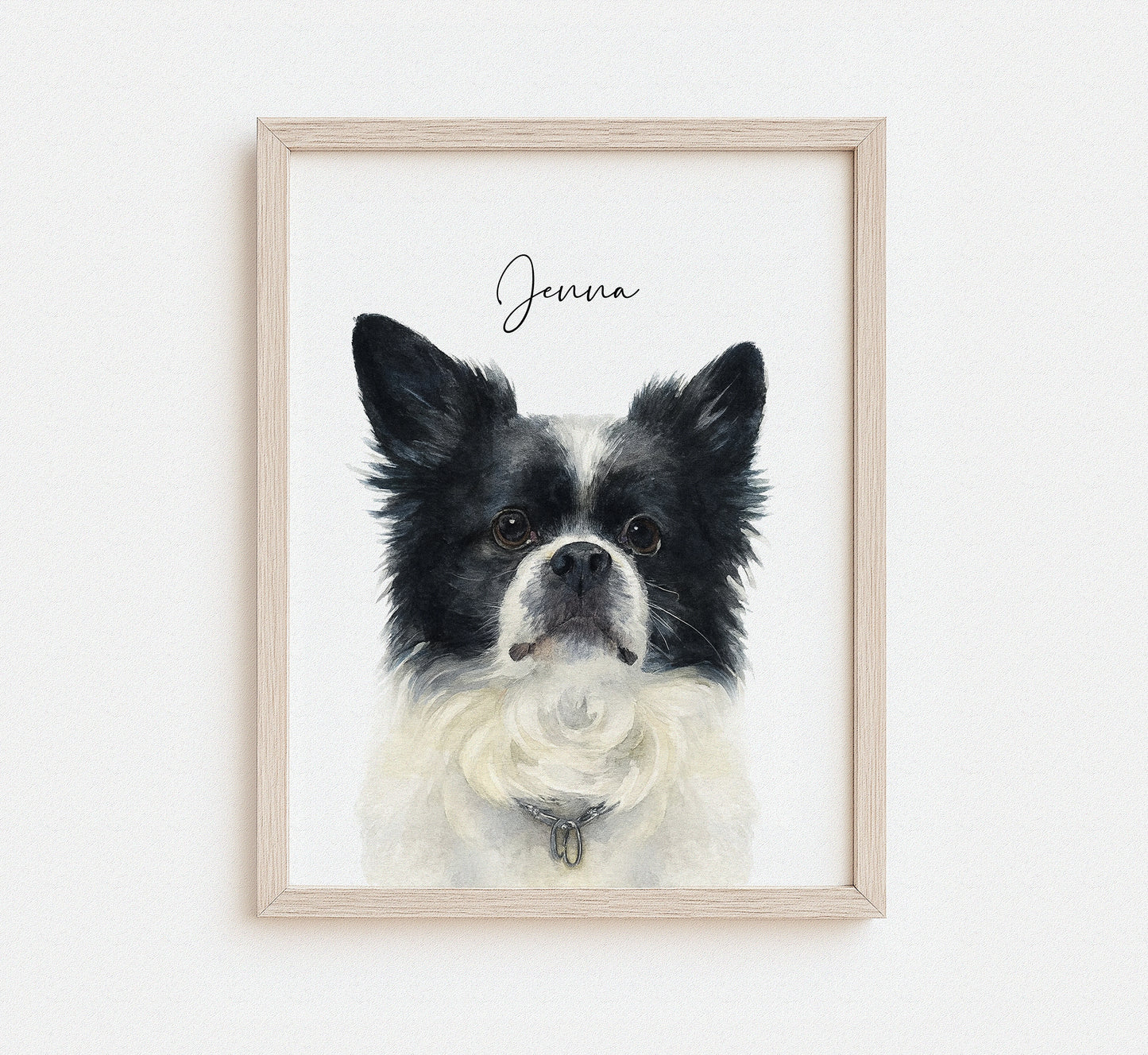 Framed artwork of a black and white dog with 'Jenna' written above on a white background