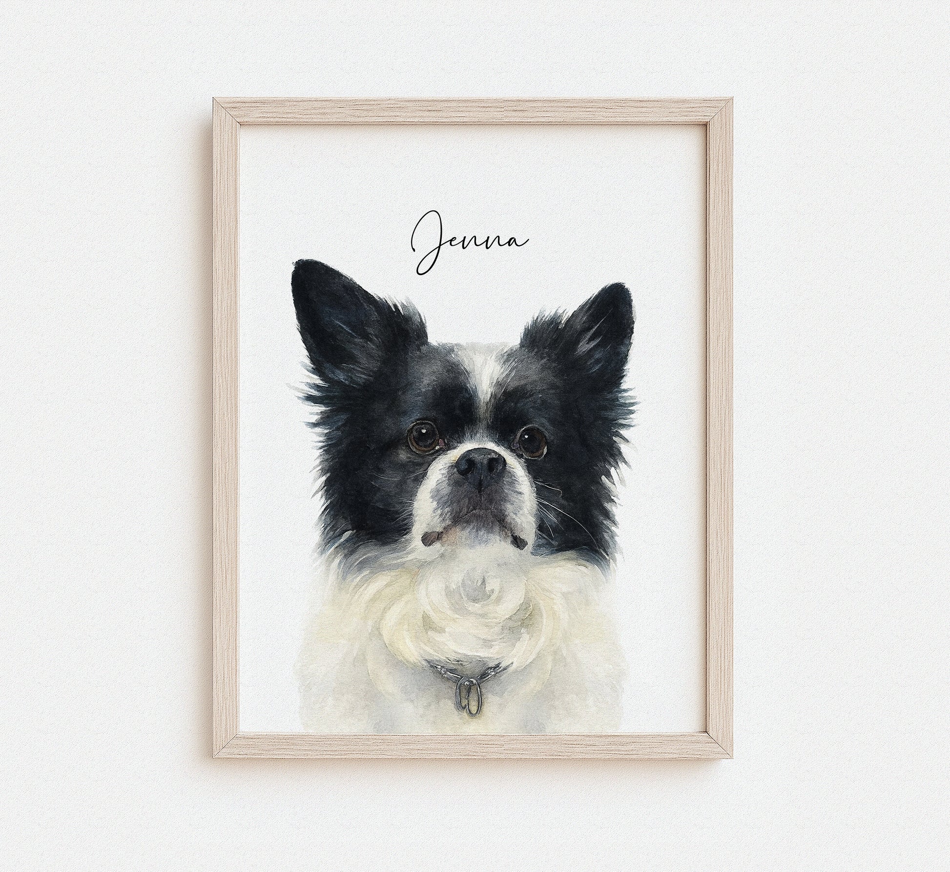 Framed artwork of a black and white dog with 'Jenna' written above on a white background